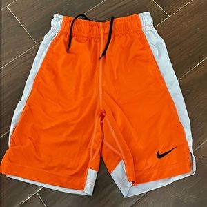 Boys orange Nike shorts size small (9/10)